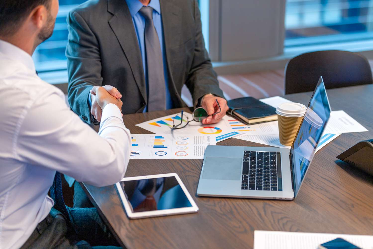 person shaking hands - AI Tools for Financial Advisors